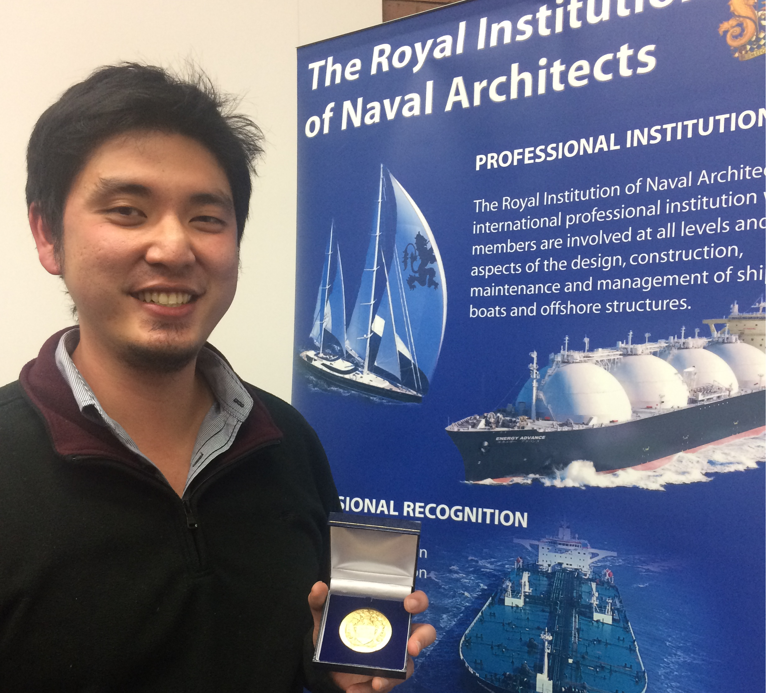 Dr Zhi Leong with his RINA medal